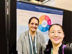 Manpreet and Ultragenyx colleague, Christy Yang, in front of the poster presentation at the ISPOR 2026 Annual Meeting.
